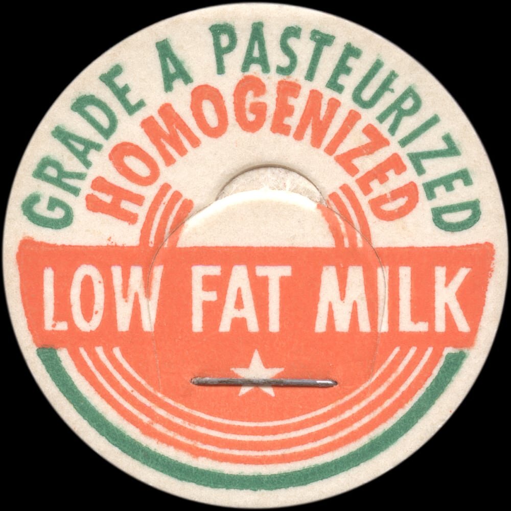 Vintage circular dairy cap with printed typographic milk advertising and a metal pull tab.
