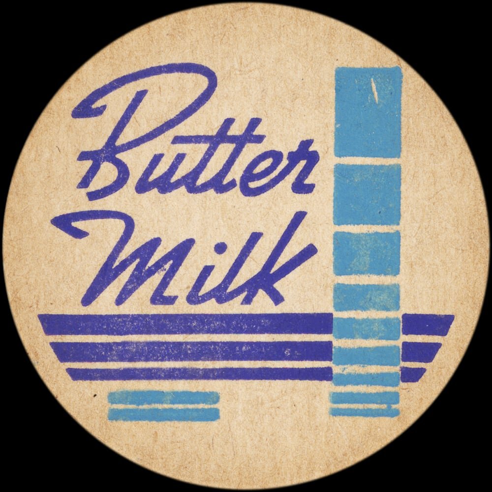 Vintage circular dairy cap with printed typographic milk advertising and a metal pull tab.