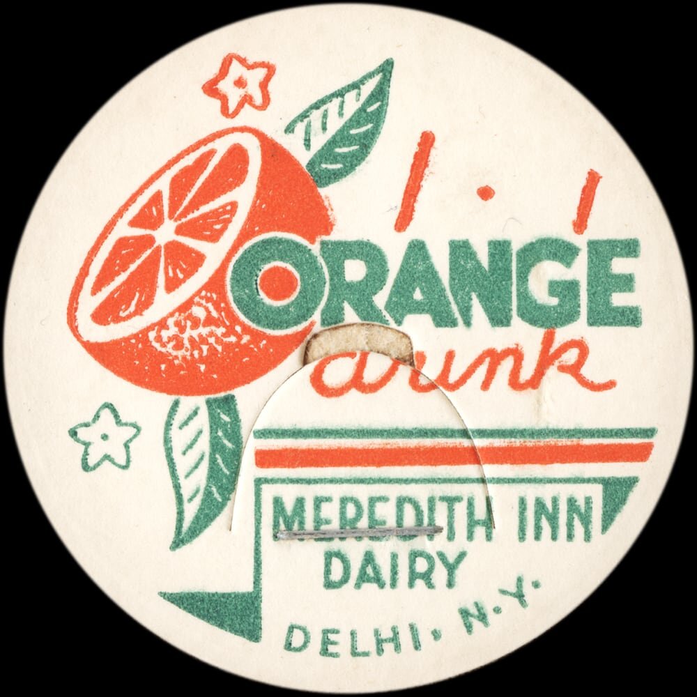 Vintage circular dairy cap with printed typographic milk advertising and a metal pull tab.