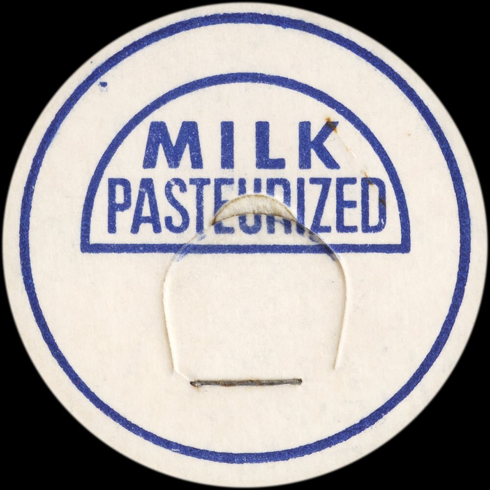 Vintage circular dairy cap with printed typographic milk advertising and a metal pull tab.
