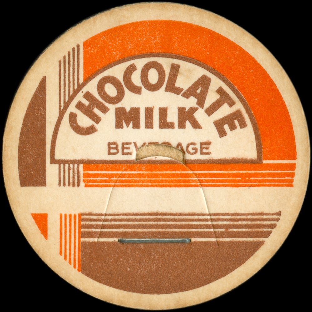 Vintage circular dairy cap with printed typographic milk advertising and a metal pull tab.