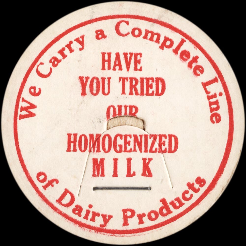 Vintage circular dairy cap with printed typographic milk advertising and a metal pull tab.