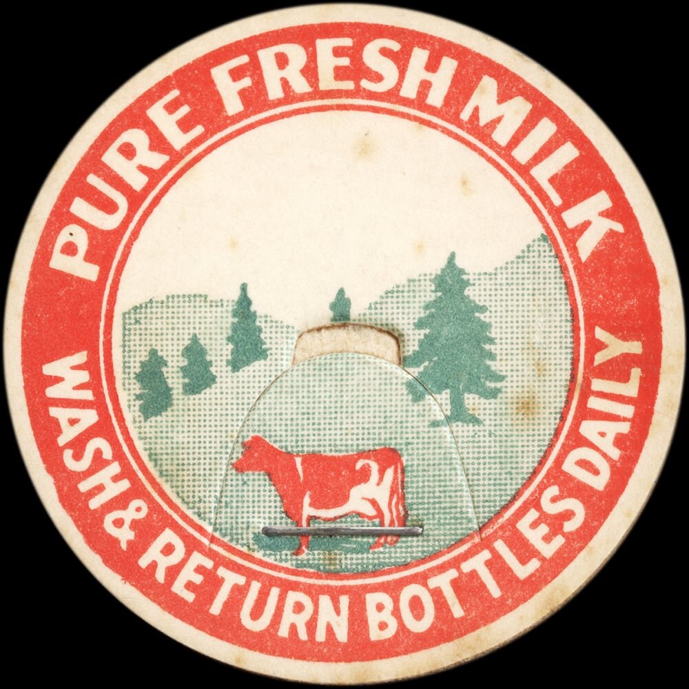 Pure fresh milk cap with red cow and pastoral scene.