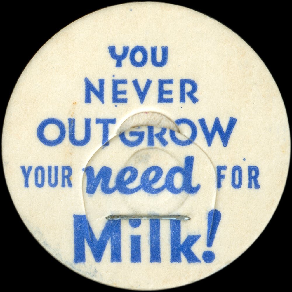Vintage circular dairy cap with printed typographic milk advertising and a metal pull tab.